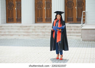 African American Graduate Holding Diploma.