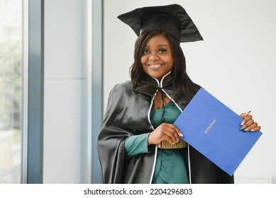 African American Graduate Holding Diploma.