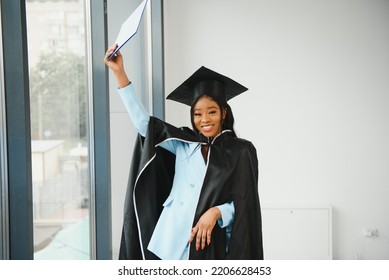 African American Graduate Holding Diploma.