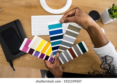 African American Graphic Designer Woman Choosing Coating Sample