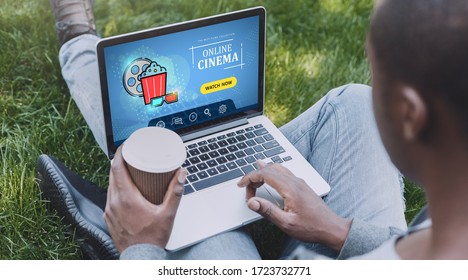 African American Guy With Laptop Browsing Online Cinema Website In Park, Collage. Panorama