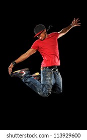 African American Hip Hop Dancer Jumping Isolated Over Black Background