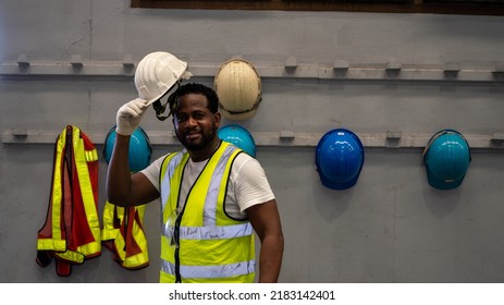 African American holding Safety Helmet , Safety helmet equipment in Manufacturing Factory site - Powered by Shutterstock