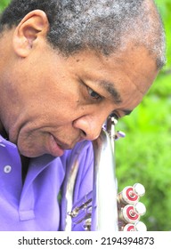 African American Jazz Musician With His Flugelhorn Outside.