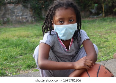 African American Kid Wearing Surgical Mask With Basketball