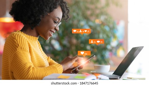 African American Lady Using Laptop Texting In Online Social Media Chat Networking Sitting In Cafe Indoors. Internet Content Concept. Panorama, Collage With Web Icons