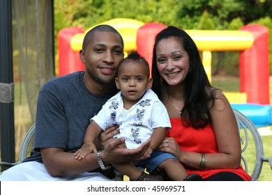 African American Latin Family At Kids Birthday Party