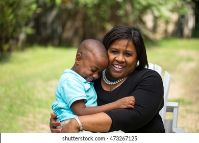 African American Little Boy With His Grandmother Having Fun And Happy Moments Together. 