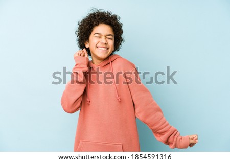 African american little boy isolated dancing and having fun.