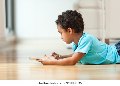 African american little boy using a tactile tablet