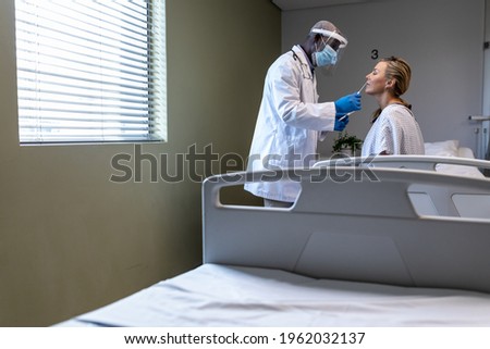 Similar – Grateful senior female patient giving gift to female doctor