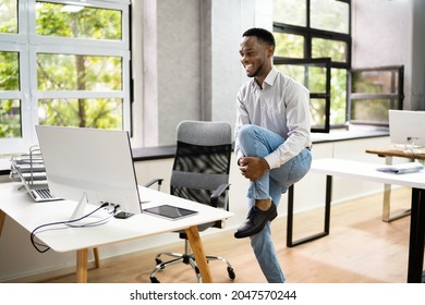 African American Male Exercise Office. Stretching Workout