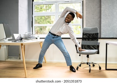 African American Male Exercise Office. Stretching Workout