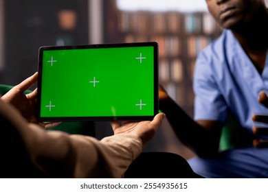 African american male nurse opening up in a counseling session, therapist uses a green screen display. Surgeon assistant experiencing post traumatic stress disorder, patient loss. - Powered by Shutterstock