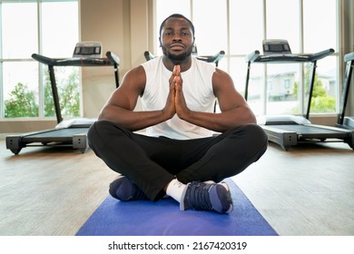 African American Male Practice On Yoga Class In Sport Club With Lotus Pose On Ground To Peaceful Health And Wellbeing Concept