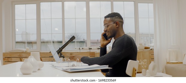 African American Male Remote Working From Home, Having Work Phone Call. Stay Home, Quarantine Remote Work