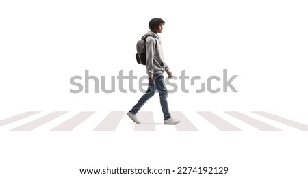 African american male student walking across a street isolated on white background