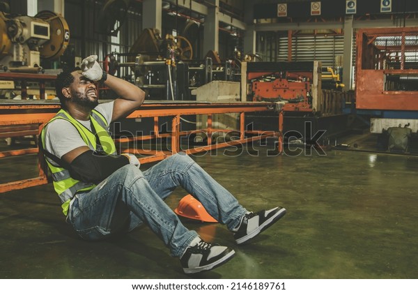 African\
American male worker with right arm injury wears cast can\'t work\
has to take sick leave for medical treatment : Male workers insured\
against work accidents that occur in\
factories.