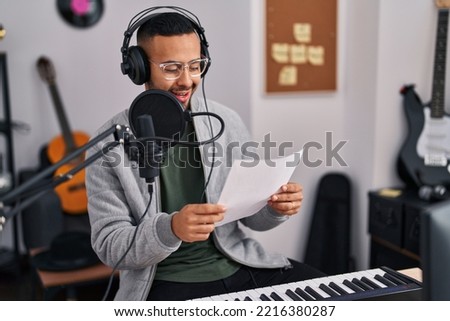 African american man artist singing song at music studio