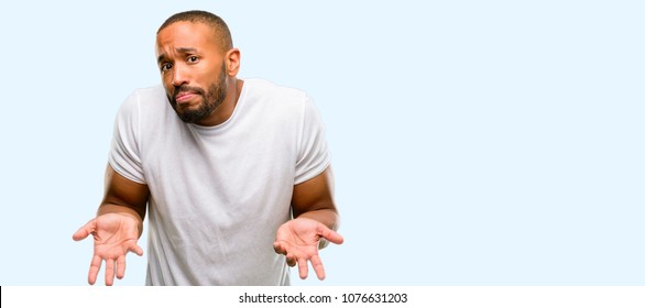 African american man with beard doubt expression, confuse and wonder concept, uncertain future isolated over blue background - Shutterstock ID 1076631203