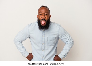 African American Man With Beard Isolated On Pink Background Funny And Friendly Sticking Out Tongue.