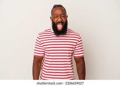 African American Man With Beard Isolated On Pink Background Funny And Friendly Sticking Out Tongue.