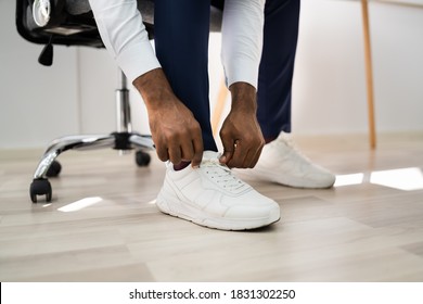 African American Man Changing To Running Sports Shoes