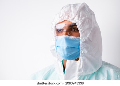 African American Man Doctor In Medical Protective Gown And Mask On White Background