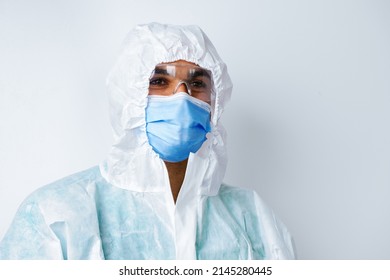 African American Man Doctor In Medical Protective Gown And Mask On White Background