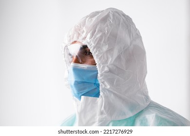 African American Man Doctor In Medical Protective Gown And Mask On White Background
