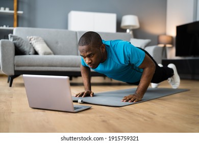 African American Man Doing Online Fitness Pushup Workout At Home