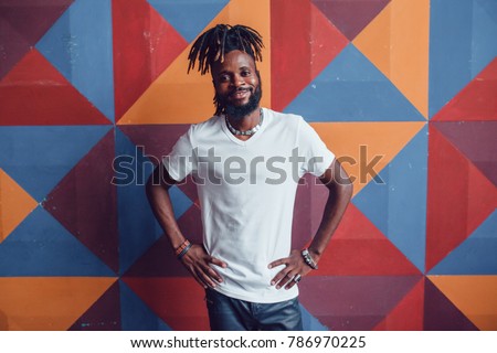 African American man with dreadlocks and a white T-shirt. Mock-up.