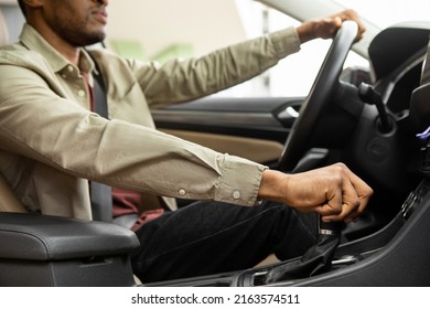 African american man driving his car shifting gears - Shutterstock ID 2163574511