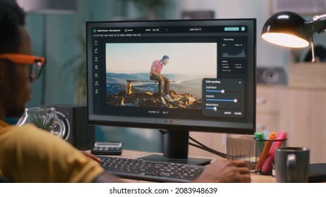 African American Man Editing Video With Chromakey Background