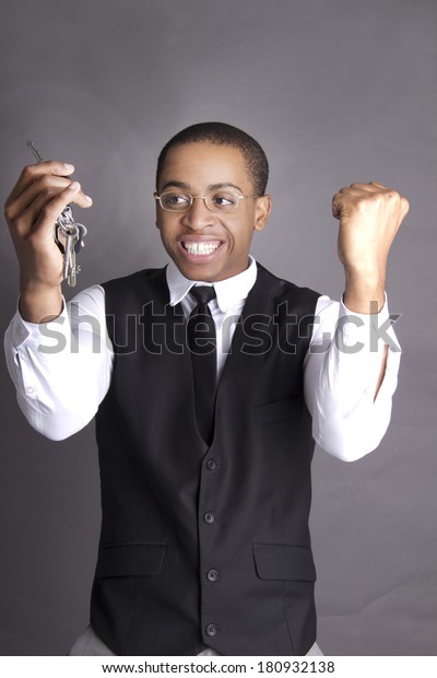 African\
American man excited about his new car\
keys