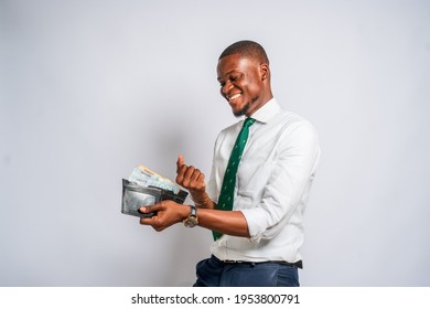 African American Man Feeling Successful And Holding Money In Wallet