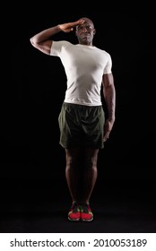 African American Man Greeting At Camera With A Military Salute In Studio