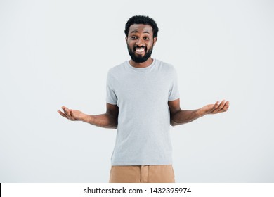 African American Man In Grey T-shirt With Shrug Gesture Isolated On Grey