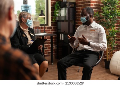African American Man Having Discussion At Aa Meeting With People Sitting In Circle At Group Therapy. Person With Face Mask Trying To Cure Addiction While Attending Support Session.