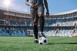 African American Man Holding A Soccer Ball In The Stadium