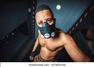 African American Man In Mask Doing Selphy In Gym. Black Man Looking At Camera And Holds Hands On Camera.