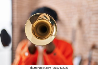 African American Man Musician Playing Trumpet At Music Studio