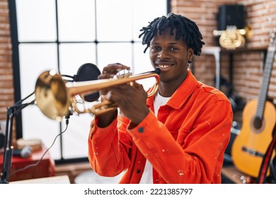 African American Man Musician Playing Trumpet At Music Studio