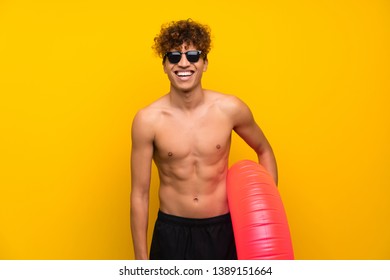 African American Man Over Isolated Purple Wall Laughing