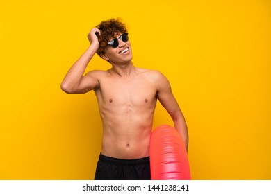 African American Man Over Isolated Purple Wall Laughing