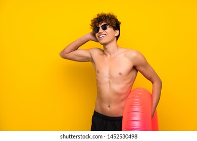 African American Man Over Isolated Purple Wall Laughing