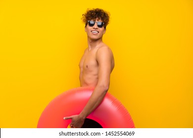 African American Man Over Isolated Purple Wall Laughing