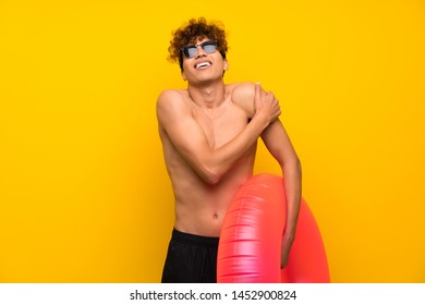 African American Man Over Isolated Purple Wall Hugging