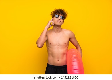 African American Man Over Isolated Purple Wall Thinking An Idea