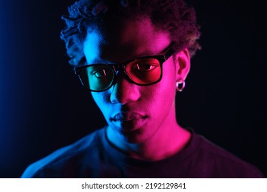  African American man portrait in sunglasses  isolated purple background